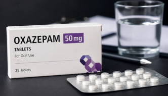 Oxazepam 50mg tablets in blister packaging with a glass of water.